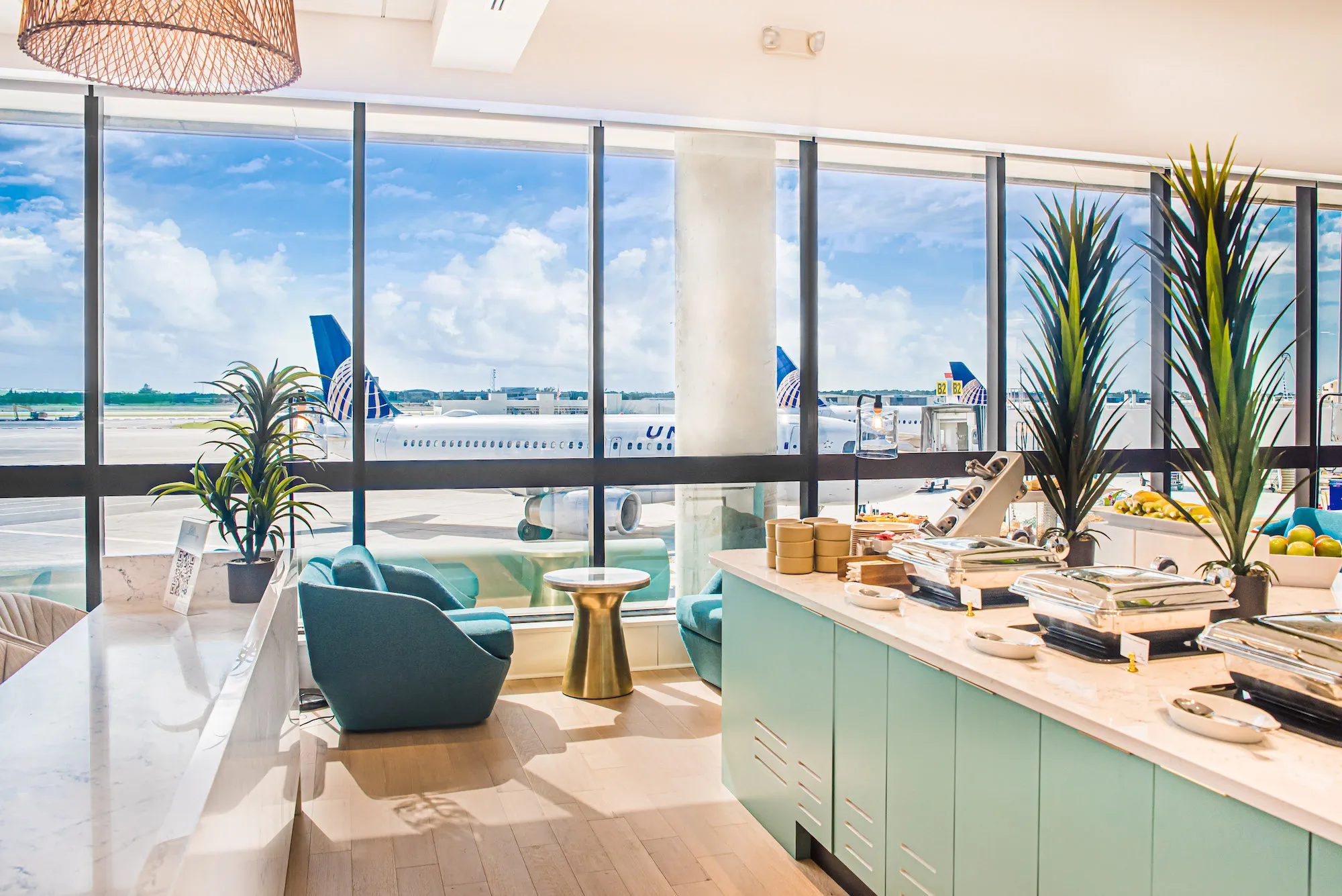 Bright, comfortable airport lounge seating area at Palm Beach International